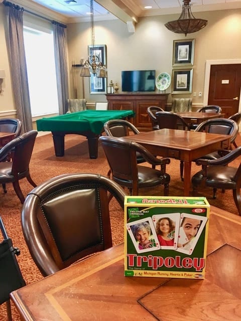 Fun & Friendship: Residents at The Terraces are dealt a hand of happiness with the game “Tripoley”